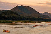 Luang Prabang, Laos - Sunset along the Mekong riverfront.  